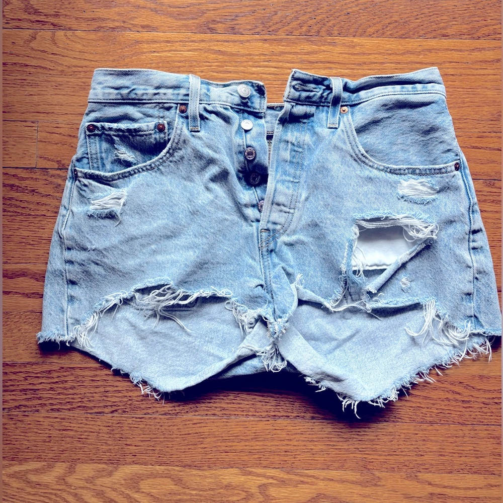 Levi’s 501 button fly distressed jean shorts. 
Size W30 
100% Cotton